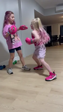 Coach Ava keeping Mila focused & ready, but they’re still sisters at the end of the day 🥊😂 #boxing #kidsboxing #girlsboxing #boxingdrills #padwork #viral #foryou #boxingcombo #coach #prettystrong #fyp 