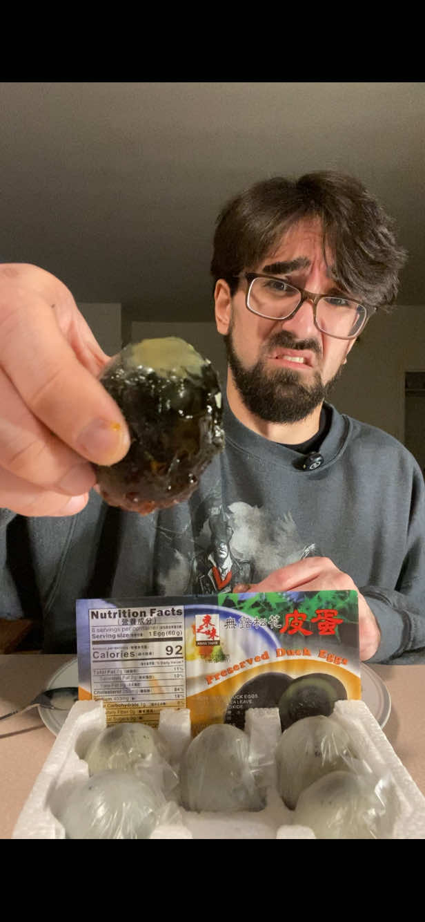 Century eggs smell awful… but they might be my new favorite eggs. #centuryegg #preservedeggs #weirdfood #foodreaction #eggtok #BoofTheDevourer #FoodTok #viralfood 