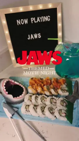 In honor of the 50th anniversary of Jaws, I had a themed movie night complete with Sharkfin Sushi Bites and Jaws Juice 🦈  #jaws #jawsmovienight #jaws50 #movienightideas #datenight #datenightideas #easysnacks #snackideas #dinnerandamovie #sushi #sushidate #sushidatenight #sharkattackdrink #soursharkdrink #gummyshark #summerdrinkideas #summerween #Summer 