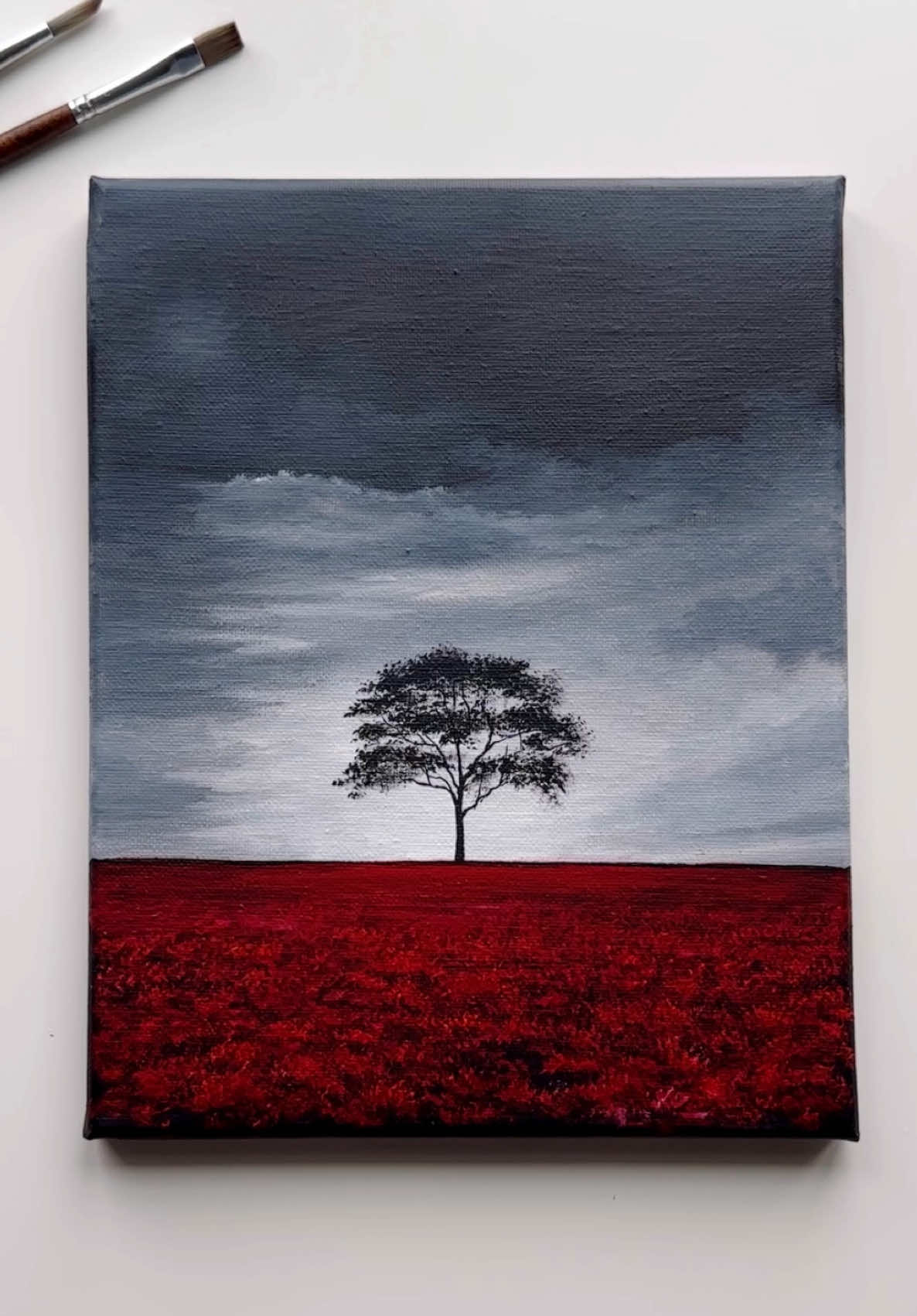 Solitude in Scarlet 🥀🖤 . . . . . . . . . . . . . . . . . . . . . . . . . . . . . . . . . . . . . . . . . . . . . . . . . . . . . . . . . . . . . . . . . . . . #acrylicpainting #canvasart #acryliconcanvas #solitude #landscapepainting #tree #cloudspainting #abminiart #traditionalart #artistoftiktok #artok #colorpalette #redcolor #akrilik #kesfet #aesthetic #creative #landscapeartist #artistoftiktok #viralart #fypツ #foryouu 