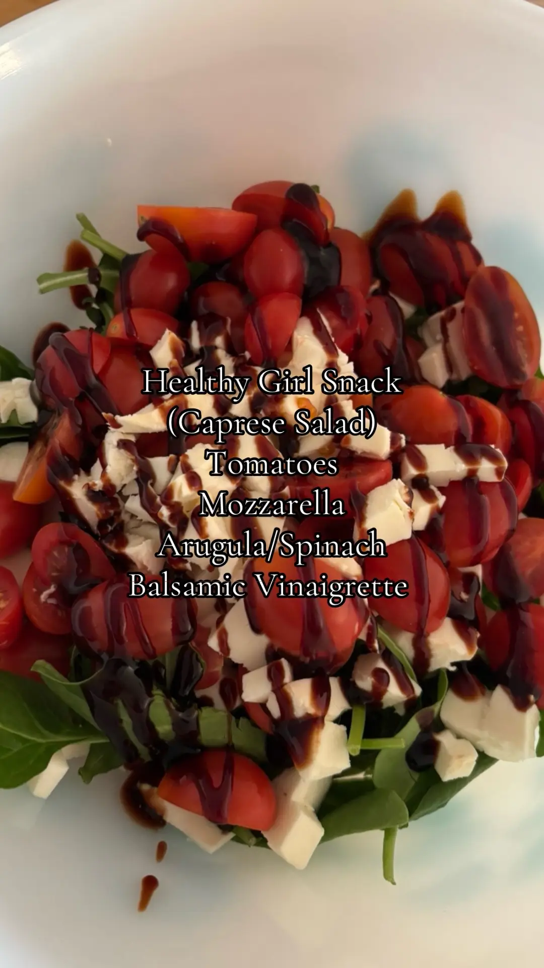 My go-to summer snack? This!  Tomatoes  Mozzarella  Mixed 🥬  #healthysnacks #capresesalad #snack #healthy #wellness 