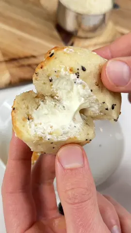 Say “YUM” if you would eat these Stuffed Everything Bagel Bites 😋🥯🙌 What you need: 1 cup Greek yogurt 1 cup almond flour 1 tsp baking powder 1 tbsp Everything Bagel seasoning 1/2 block cream cheese How to make them: 1. Roll your cream cheese into little balls and freeze until firm. 2. Mix together the yogurt, almond flour, baking powder, and EBTB seasoning to form a dough. Knead for a few mins.  3. Form the dough around each frozen cream cheese ball. Spray with oil.  4. Air fry at 360F for 10 minutes until golden and crispy. Take them out & enjoy!