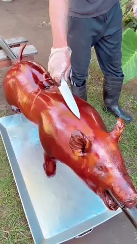 Babi guling  📍 Bali, Indonesia 🇮🇩 Explore Bali: https://www.tasteatlas.com/bali Babi guling is a traditional Balinese dish featuring spit-roasted whole pig, marinated with a blend of turmeric, garlic, ginger, and other spices. Slow-roasted over an open flame, the skin turns crispy while the meat becomes tender and flavorful. Typically served with rice, lawar (a vegetable and coconut salad), and sambal, it offers a rich combination of textures and bold, spicy flavors. Traditionally, babi guling is prepared for special ceremonies, but today it’s enjoyed by locals and tourists alike in Bali’s many warungs (local eateries). Video: @babiguling_golden