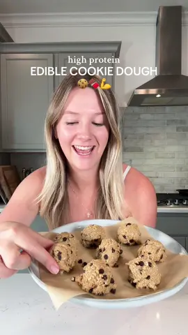 HIGH PROTEIN EDIBLE COOKIE DOUGH! 🍪🍫 If you have a sweet tooth but want a healthier option you need to try these! These are packed with protein, healthy fats and fiber and are sooo delicious! My favorite protein powder is @Promix Nutrition vanilla whey - I have used it for years and love the taste, texture and clean ingredients! You can use my code ✨CLAIRE✨ to save 10% on all Promix orders! Makes 12 servings: ~130 calories, 9g protein, 18g carb, 4g fat each  What you need: - 2 cups oats blended into flour - 3 servings Promix vanilla protein powder (discount code - CLAIRE) - 2 tbsp cashew butter - 1/4 cup maple syrup - 1 tsp vanilla extract - 1/4 tsp salt - 1/3 cup almond milk  - 1/4 cup dark chocolate chips Topping: - 1/4 cup dark choc chips - 1 tsp coconut oil How to: - Blend oats into a fine flour. - Add oat flour, protein powder, cashew butter, maple syrup, vanilla and salt to a bowl and mix well. - Add a splash of milk at a time and mix until a very thick dough forms. - Fold in choc chips then scoop or roll into 12 balls. - Store in the fridge in an airtight container 🫶 #promix #EasyRecipe #discover #reels #reelsinstagram #tiktok #reel #discovery #fyp #foryou #foryoupage #healthy #food #Foodie #healthyfood #healthyfoodie #healthyrecipes #insta #instagood #reel #instareels #yummy #wholefoods #fitrecipes #mealprep #cookiedough #healthycookies #proteinbar #highproteinsnack #highprotein #snackidea #snack