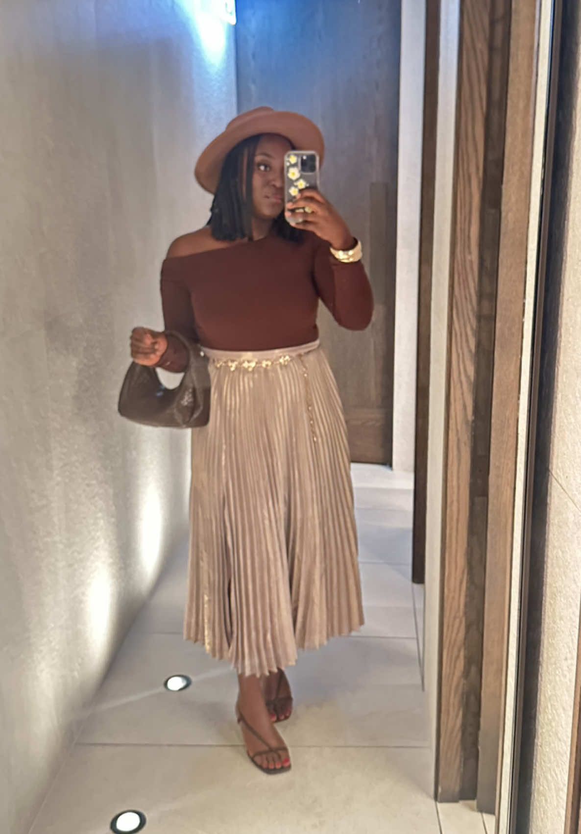 Top + belt: @valleygirlfashion  Skirt: @witcheryfashion ~ @UTURN  Heels: @witcheryfashion Bag: @TK Maxx  Hat + earrings : @kmart australia   #sierraleonetiktok🇸🇱 #sierraleonesong #sierraleonetiktok🇸🇱🇸🇱✅💯happy #transitioner #sierraleonetiktok🇸🇱🇸🇱🇸🇱 #fypシ゚viral #fyp #loveyourself❤️ #dinner #styling #monochromatic #nude #brownonbrown #monochrome #pleatedskirt #asymmetrical ##africantiktok #african #blackbeauty #