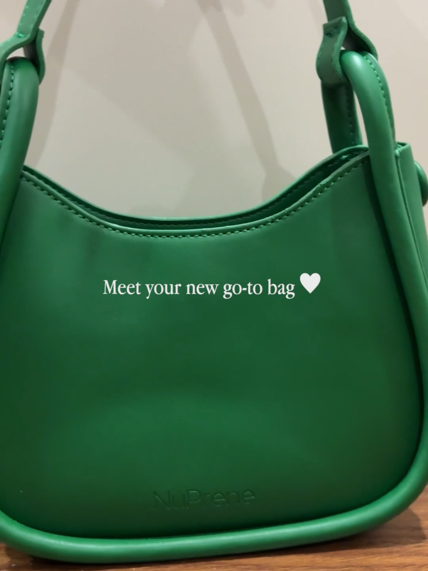 This gorgeous emerald green color will be your perfect statement bag! 💚 Shop the Olivia Mini Hobo Bag in Emerald on the yellow basket! 🛍️ #minibag #shoulderbag #slingbag #handbag #nuprene
