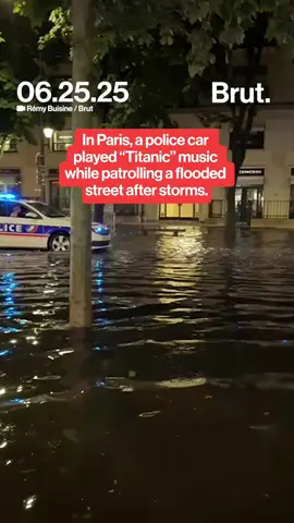 A Paris police vehicle was caught blasting the Titanic theme song as it drove through a flooded street after heavy storms. (Footage by @remybuisine for Brut.) #parisfloods #titanicmoment #stormyparis #climatechaos #viralvideo #parisweather #brutnews #floodedstreets #policepatrol #celinedion