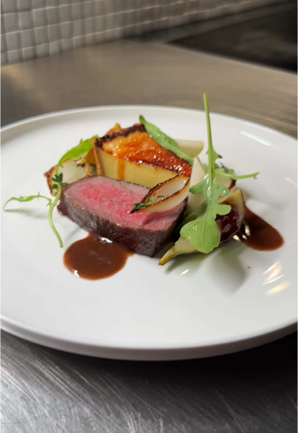 POV: when she tells you size matters. #tart #steak #legruyereaop First Course: Sous vide sirloin steak served with roast jus, Le Gruyere AOP cheese tartlet, fresh figs, rucola, pear slices, aged balsamico, and thyme roasted onions. Second Course:  Peanut butter and hazelnut ganache mousse bar served with coffee chocolate ice cream and chocolate coffee sauce.  Notes: The steak was done at 54C/129F for 3 hours. Seared and basted with butter, garlic, and thyme. Simple Roast Jus:  400g roast stock 400g water  Beef trimmings (includes some smaller bones) 4 small white onions Generous splash of cognac 2 sprigs of thyme Nob of butter to finish