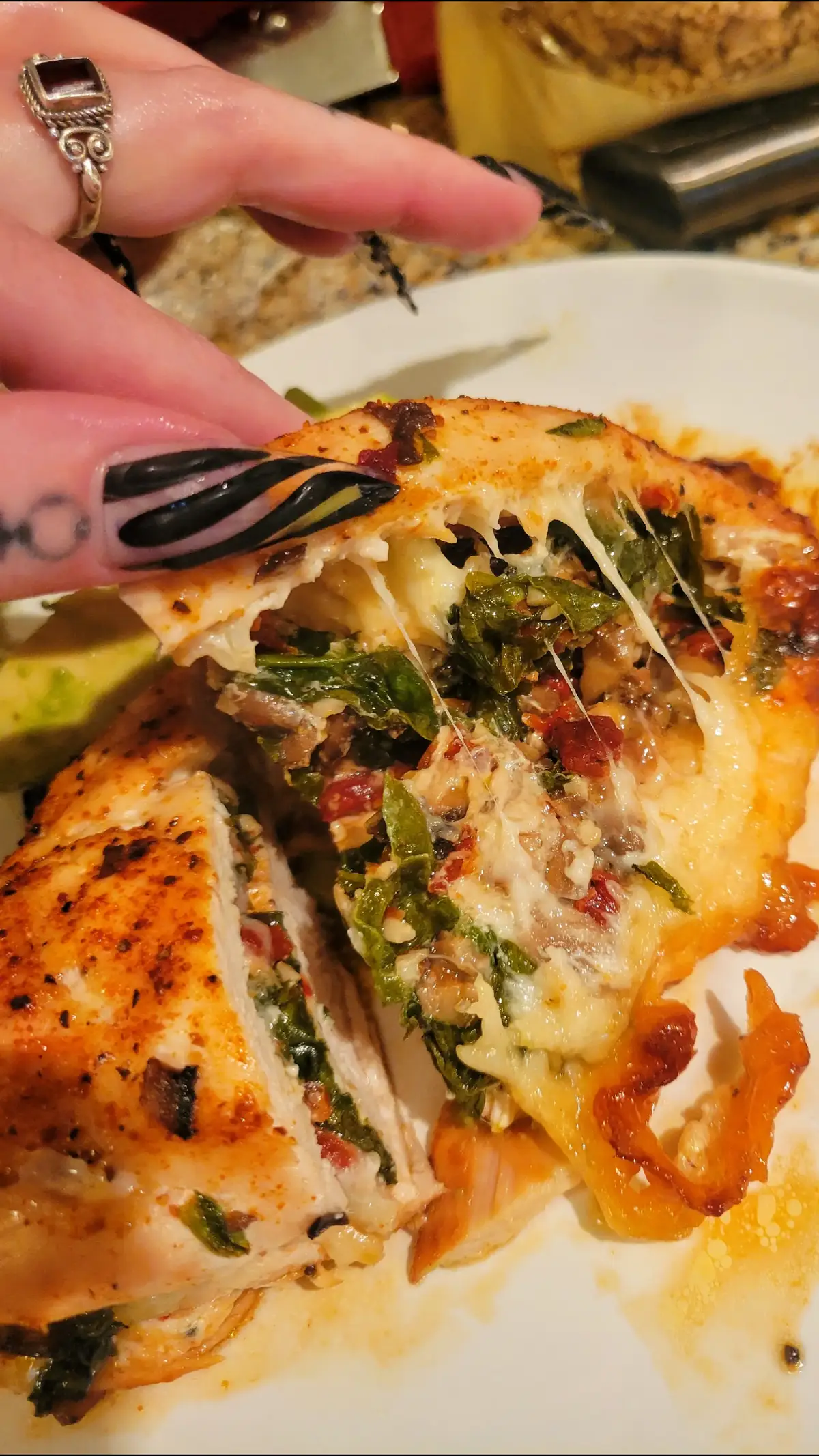 Mushroom, sundried tomato, garlic, spinach and provolone stuffed chicken topped with avocado. Super easy and came out pretty dang yummy 😋 #DinnerIdeas #dinnerrecipe #chicken #chickenrecipe #stuffedchickenbreast #Recipe #cooking #bakedchicken #sundriedtomatoes #spinach #mushrooms #cooking #cookingathometiktoktv #easycooking #healthy #healthyrecipes 