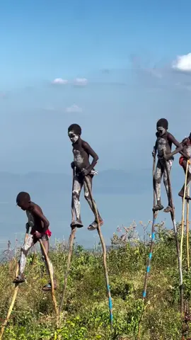 How about walking on air just like Banni boys? . . . . . 📷info@shigoethiopiatours.com Experience the vibrant culture of the  Omo Valley tribes in Southern Ethiopia .Get a glimpse into their daily life, from the early morning milking rituals to the evening storytelling sessions around the fire.  Contact us today to craft your dream itinerary and embark on an unforgettable journey through the land of ancient wonders and breathtaking culture. #african #africanculture #unique #tribaltours #ethiopiantribes #stiltwalker #banna #ethiopia #travelguide #culturaltourism #omovalley #slitswalker #bannaboys #travelphotography #travelgram #tribalphotography #picoftheday #travelethiopia #shigoethiopiatours #tribalexpirience #discoverafrica