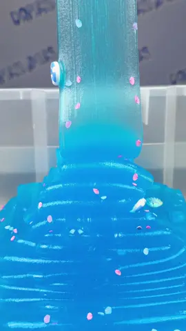 name this slime🏖️ — jelly slime pour!🐚 this jelly slime is the bottom part of our beach breeze hybrid slime✨ the sea shell fimos + charms give this slime such a summer vibe☀️ - shop this slime + more at dopeslimes.com or link in bio! — #slimepour #satisfying #beachbreeze #jelly #seashell #beach #namethisslime 