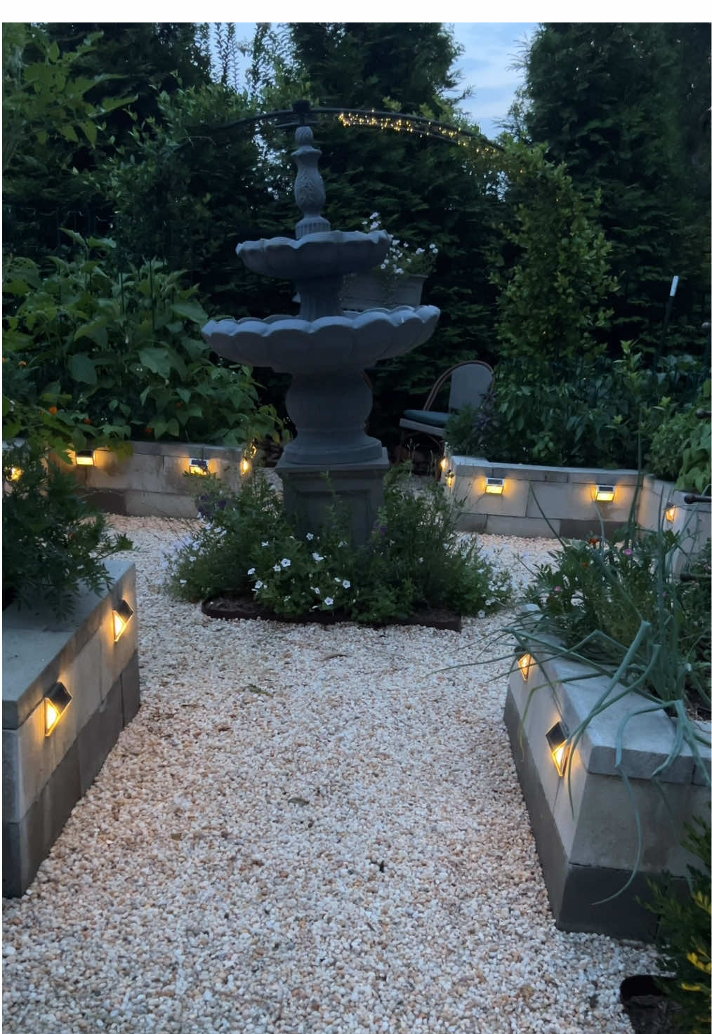 Magic during the day with veggies and magic now at night with all these solar lights 😍  All these lights and more linked in my Amazon storefront! adding twinkle made the garden feel like a fairytale at night!!! I want to keep adding more lol I applied these lights onto the concrete blocks with heavy duty command strips and some of these have been up for 2.5 YEARS with command strips alone! I have them all over our yard including our stairs too! In this video you see me reattaching 3 that got knocked off by a wheelbarrow lol #solarlights #gardenlighting #gardendiy #landscapelighting #magical #kitchengarden #raisedgarden #gardening #northcarolina #raleighnc #farmtotable #zone8a #zone8b #zone7b #amazonfind #elegantgarden #frenchgarden #potager #parterre 