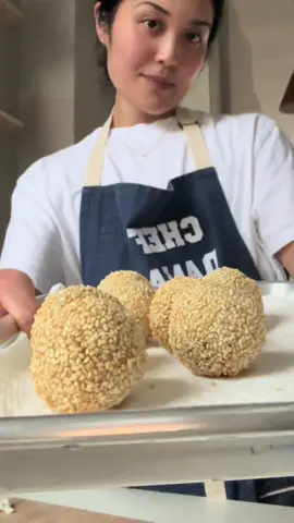 we have dim sum at home 🤷🏻‍♀️ my first attempt at a Chinese pastry called fried sesame balls (jian dui / ma qiu), filled with black sesame paste (an elite version of peanut butter imo) 😋 recipe by @WoonHeng (woonheng.com), so easy and straightforward! 2 helpful frying hacks: 1. use a candy thermometer to monitor and maintain the temperature of your oil. this might seem like common sense, but i used to blindly guess the oil temperature, which resulted in oil splatters and slippery kitchen floors for days 😅 2. cleanly dispose of your fry oil by sprinkling @fryawayco plant-based powder into your hot oil.  as it cools, it will form a solid disc, making it easy to toss in the trash in one shot. use my link in the comments to get 10% off with code DANA10 😊🔗 #dimsum #dimsumlover #homemadedimsum #sesameball #fried #chinesedessert #asiandessert #mochi #KitchenHacks #asseenonsharktank #fryaway #jiandui #maqiu 