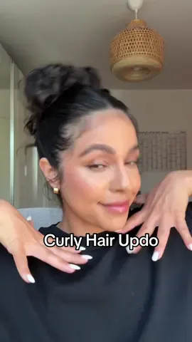 Easy curly updo for thick, natural hair. Perfect for second-day curls, crazy hot weather , or when you need a quick, frizz-free style that still looks put together. #curlyhairroutine #curlyhair #curlyhairupdo #updohairstyle #updo 
