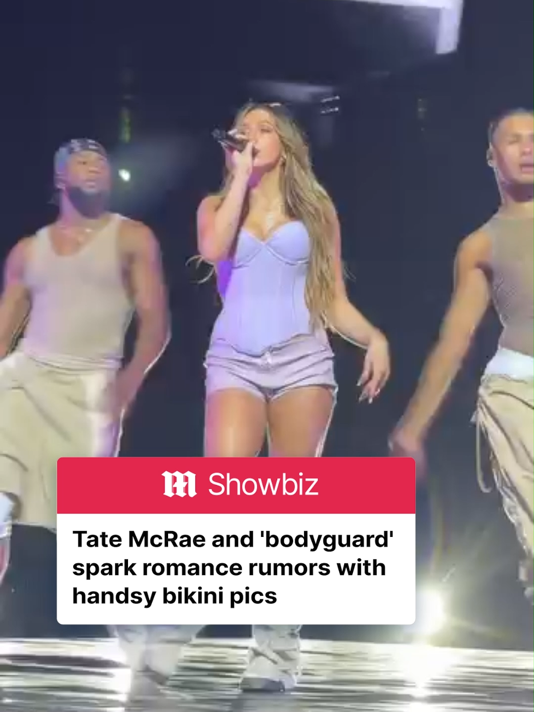 Fans are speculating the relationship status of Tate McRae and The Kid Laroi after the Canadian popstar was spotted looking VERY cozy with her apparent 'bodyguard' on holiday. According to photos published by DeuxMoi - McRae was seen with her bodyguard PRETTY close behind her as she climbed out of the water in a lime bikini. Some online have said the mystery man was 'simply trying to shield' Tate but what do you think? Read more on DailyMail.com #tatemcrae #thekidlaroi