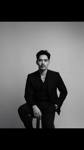 Photo editing with Sora  1. Open Sora  2. Upload your Image. 3. Copy Paste the Prompt below 👇🏻 Use the person's face from the uploaded image as the main identity. Keep the face structure, skin tone, hairstyle, and expression as close as possible. Do not change or edit the face. Use the image to create A dramatic white and white potrait of a confidence looking man. Sitting on a wooden stool against a white studio background . He is wearing a well fitted, all-black suit with a black shirt and a black pant small silver chain at naki and small silver watch. Slightly unbuttoned at the top. Executing a moody and powerful aura. His posture is relaxed yet dominant ,with one arm resting on his leg and other one in his pant pocket the lightning is soft but directional creating with this make my hair formal look and very decent, also generate with good jaw line and a natural face should look good  Give with same beard and little moustache #ai #chatgpt  #chatgptprompt  #style #professional 