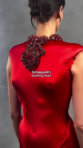 Debuted just a few hours ago on the runway, Daniel Roseberry showcased a Schiaparelli red dress adorned with a beating heart 🫀 #danielroseberry  #schiaparelli #dress #fashiontiktok #TikTokFashion #red #paris #pfw #couture #hautecouture #pariscoutureweek 