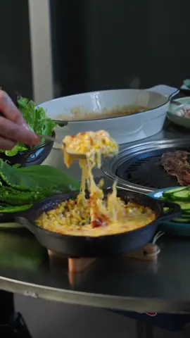 Korean bbq for babe 🇰🇷 Ssamjang Ingredients ⅓ cup (60ml) Doenjang 2 tbsp Gochujang 2 spring o nions, finely sliced 1 clove garlic, finely grated 1 tbsp corn or rice syrup 1 tbsp sesame oil 3 tsp sesame seeds, toasted Method Combine Doenjang, Gochujang, onions, garlic, corn syrup and sesame in a medium bowl. Mix well until smooth, then fold in sesame seeds.  Serve this dipping sauce as part of your Korean BBQ feast with beef slices, pork belly slices, perilla leaves, cheese corn, sweet and sour cucumbers and any other side dishes you prefer.  Corn Cheese Ingredients 2 ears corn, husks and silk removed 20g butter 3 spring onions, finely sliced, green and white separated ⅓ cup kewpie mayonnaise 1 tbsp caster sugar ½ tsp garlic powder Salt and pepper ¾ cup grated mozzarella cheese Method Preheat oven to 205°C fan forced (400°F). Slice the corn kernels off with a sharp knife.  Melt butter in an oven proof heavy based frying pan over medium heat. Cook the corn and white part of onions for 5 minutes, until starting to brown.   Remove from the heat and stir in the green part of onions, kewpie, sugar, garlic powder and half the cheese. Season with salt and pepper.  Spread mixture out to an even layer and sprinkle remaining cheese over top.  Transfer to the oven and bake for 15 minutes, then switch the oven to grill and cook a further 2-3 minutes until the cheese starts to char a little.  #cooking #bbq #korea #viral 