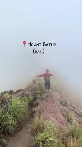 📍 Mount Batur, Bali I climbed a volcano before sunrise and honestly? 11/10 main character moment. How to get there ↓ – Book a sunrise trek (most include hotel pickup around 2–3AM) – Drive time from Ubud: ~1.5 hours – You’ll hike ~1.5–2 hrs in the dark, bring a light jacket + good shoes with grip.  🧡 Insider tip: At the top, local guides boil eggs in volcanic steam + sell hot tea. Bring cash and say yes to both. Magic tastes better warm. My guide was one of a kind! He also brought breakfast, took care of us, and captured amazing videos/pictures. I took this one of him.#MountBatur #BaliSunrise #VolcanoTrek #BaliBucketList