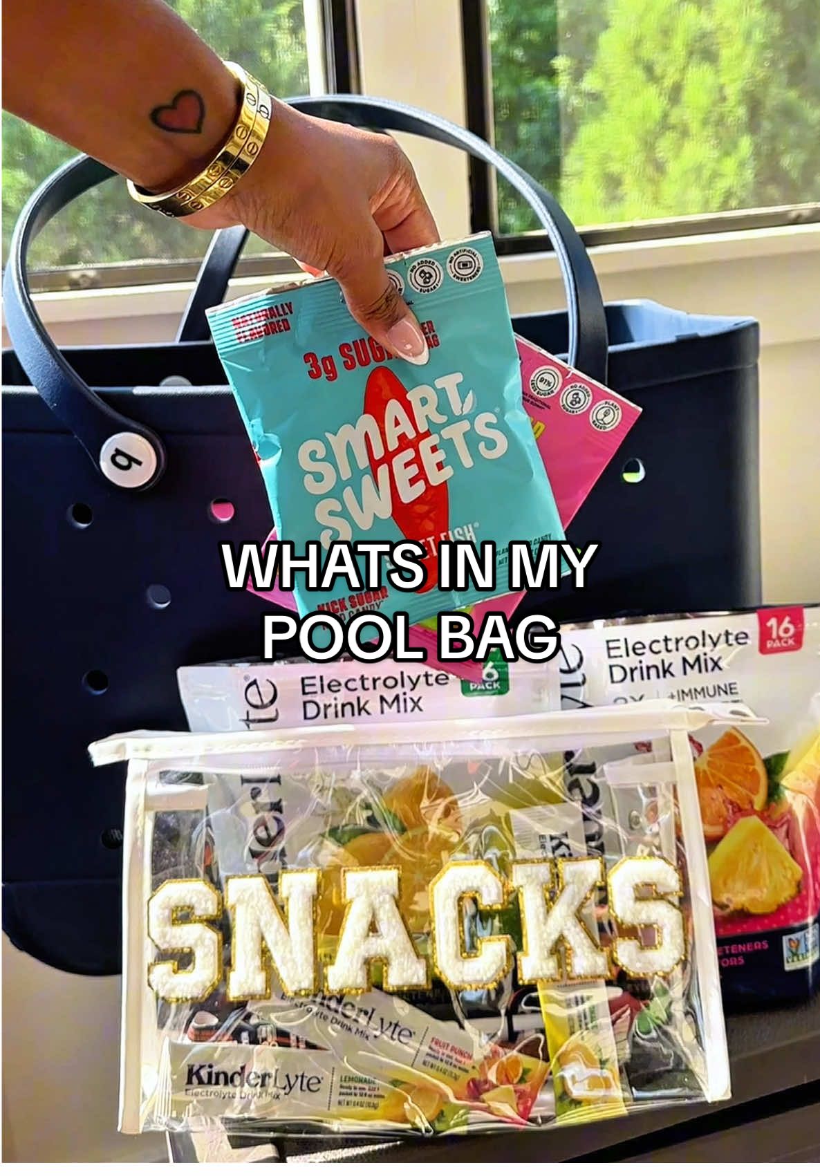#ad Summer Essentials ☀️ What's In My Pool Bag 💧 @KinderFarms KinderLyte hydration powders keep me refreshed with electrolytes + zinc—no artificial sweeteners or dyes.  🍬 @SmartSweets satisfy my sweet tooth with up to 92% less sugar and no sugar alcohols.  🥩 @Wenzel’s Farm PRO sticks pack in 16g of protein and bold flavor, perfect for snacking on the go. All items are linked in my bio! #SummerWellnessBB25 #ChooserKinder #KinderLyte #SmartSweets #realmeat4realife #wenzelsfarm #prostick #poolbagessentials #boggbag #candy 