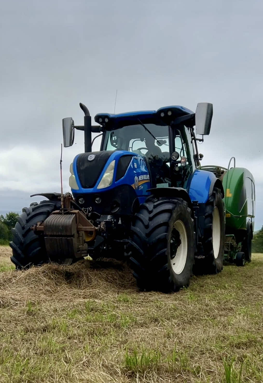 Not used to having these bad boys in our fields! 🚜 #newholland #haybales #tractor #guthealth #naturalhealing #wellness 