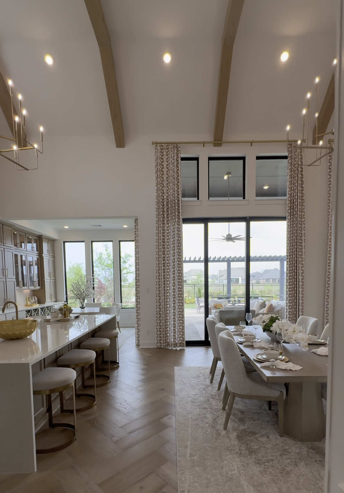 ✨ The Ultimate Luxury Dream Home In Houston, TX ✨  Welcome to the ultimate model home, where luxury meets modern design! 🏡 Nestled in the heart of the Houston suburbs, this 5,000 SF beauty boasts 5 spacious bedrooms 🛏️, 9 bathrooms 🛁, a media room 🎬, office 💼, a loft/game room 🎮, and a 4-car garage 🚗—all designed with elegance and comfort in mind. From the moment you walk in, you're greeted with soaring high ceilings 🏛️ and stunning wood beams that set the tone for this exquisite space.  The open-concept layout 🌀 is perfect for entertaining, featuring a grand entry stairwell, a waterfall kitchen island 🍽️, and three large kitchen windows 🌞 that flood the space with natural light. Every detail—from the custom-built shelving in the living room and office to the gold accents ✨ and chandeliers 💡throughout—adds a touch of luxury.  The primary bathroom feels like a spa retreat 🧖‍♀️, with built-ins in the closet and ample space to unwind 🌿. Don't miss the loft area with a wet bar 🍸 and openings that overlook the main living space—making it the perfect place for both relaxation and entertainment 🛋️🎉. This home is staged to perfection 🎨, allowing you to easily imagine your life and home decor here.  With a starting price just under $1 million 💰, this floor plan offers incredible value for such a luxurious space.(Keep in mind, many of the features shown here are upgrades 🔧 and would be an additional cost.)  I'm not affiliated with the builder 🏗️—just sharing one of Houston's finest model homes! If you're interested in this stunning floor plan, I'd be happy to connect you with the amazing and personable sales rep 🤝 who can help make your dream home a reality 🏠💫! Love what you see? 💕 Share this tour with a friend 📲 and follow for more breathtaking home tours like this one! You might just find your next dream home 💭🏡! 📍Katy, TX 🏘️ Elyson 🏡 Highland Homes #newbuild #homebuyers #openconcept #dreamhome #highceilings #realestategoals #interiordesign #homedesign #housetour #homesweethome #realestatetiktok #modelhome #luxuryhomes #kitchendesign #bathroominspo #luxurydesign #houstonhomesforsale #housegoals #luxuryrealestate #modernhome