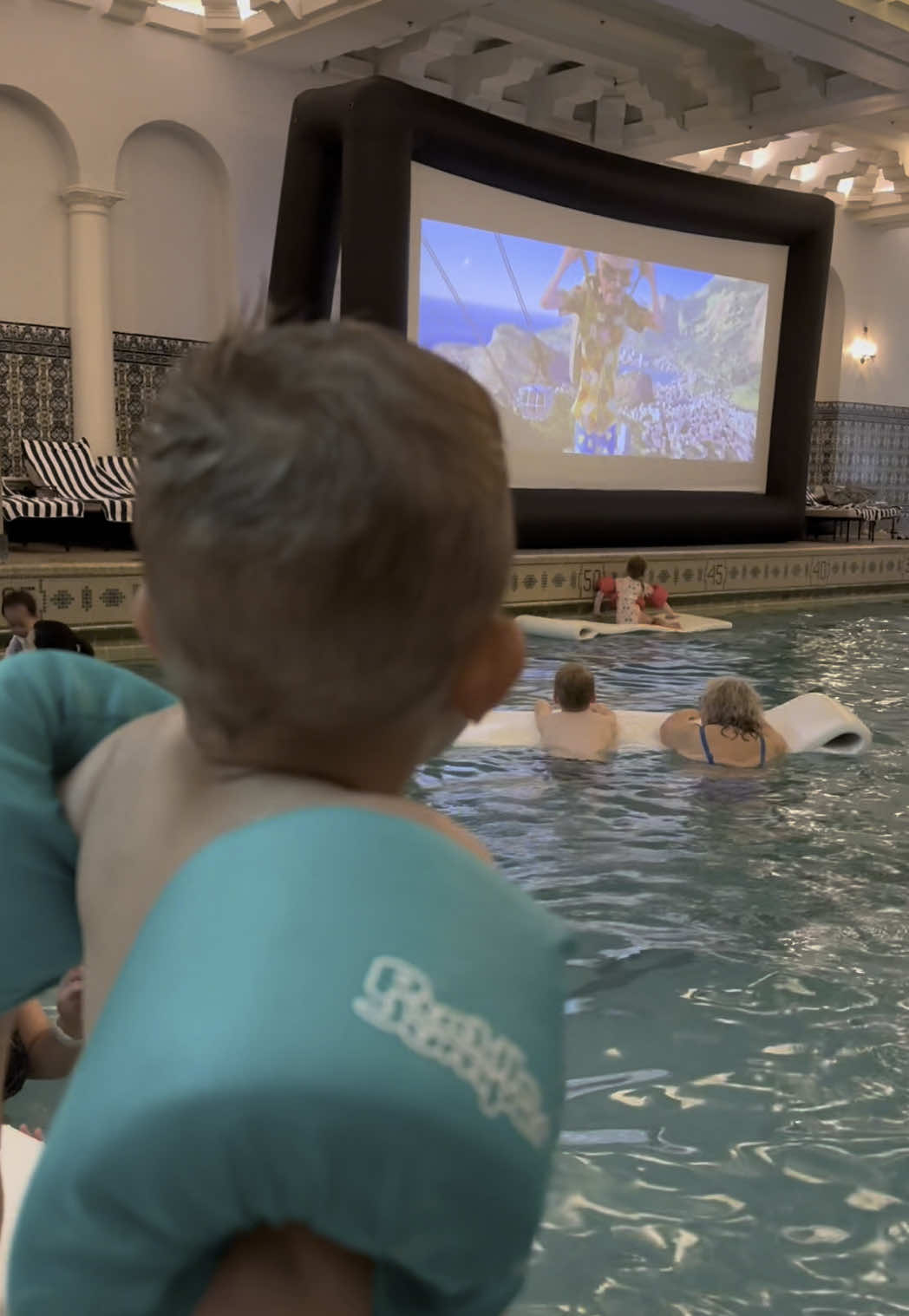 Dive In Movies at the InterContinental Chicago on the Mag Mile 🏊‍♂️ As if this pool could get any more iconic, every Friday and Saturday evening from 6:00-8:00pm you can watch a family friendly movie (we watched Rio) while floating in the pool.  🍿They serve popcorn and lemonade and it was the best summer dinner.  It’s free if you’re staying at the hotel, but you can also purchase a @resortpass for the day and it’s included in that as well! This was a fun little daytrip! My guys loved this. Halfway through the movie, my oldest wanted to watch the movie from our chairs which are in a nice tiered setup. Have you ever watched a movie while in a pool?  #intercontinental #intercontinentalchicago #magmile #magmilewithkids #thingstodowithkidsinchicago #kidsinchicago #intercontinentalpool    @ResortPass @interconchicago 
