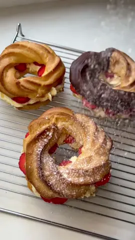 Strawberry & Cream Puffs🍓🍦 With choux pastry you can also make eclairs and profiteroles too🤪 Ingredients for choux pastry:  -240ml water  -113g unsalted butter  -1/2tsp salt  -120g plain flour -3 eggs Ingredients for whipped cream: -500g mascarpone  -80g sugar -3tsp vanilla extract  -500ml double cream (mix gradually) Method: STEP 1: In a pan add your water, softened butter and salt. Bring to a boil and make sure the butter is fully melted. This is a must that it’s to the boil as otherwise the dough won’t form!  STEP 2: Once on a boil take of the heat and immediately add in the flour and continually stir for a few minutes until the dough falls of the side of the pan and creates a dough. Place back onto heat (low heat) and continually stir for a minute. STEP 3: Let the mixture cool down for about 10 minutes and then gradually add one egg at a time until the mixture combines as one. The mixture will separate so don’t worry when it does! You want the mixture to sit on the spoon however slips off after a few seconds. You don’t want the mixture thin!  STEP 4: Pipe onto a tray and cook for 25 minutes at 210c. Leave to cool, add your cream, strawberries and chocolate on top and enjoy these delicious cream puffs🍓🍦 #strawberrycream #EasyRecipe #chouxpastry 
