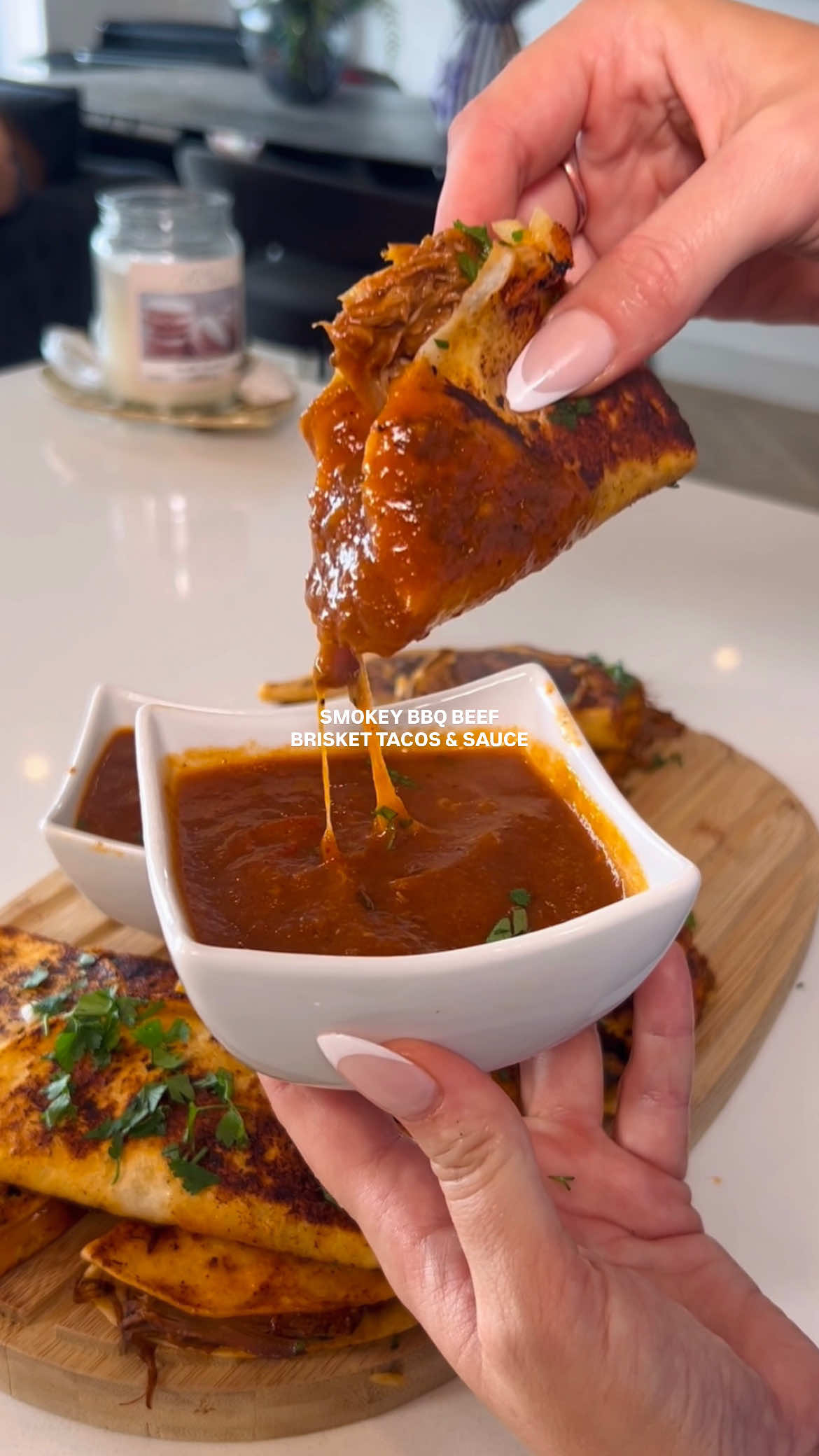 Smokey BBQ beef brisket tacos with a dipping sauce.. soooo so good! Click save and share/tag somebody who needs to make this for you.  Follow me for more @jadecarolanfitness Macros👇 Calories 251 Protein 15g Fat 13g Carbs 19g Ingredients 👇 750g beef brisket 500g sweet ripened vine tomatoes 1 white onion 4 large garlic cloves or 8 small 20g puree 300ml beef bone broth 35g smokey bbq fajita seasoning from @Old El Paso  1tsp ancho chilli flakes salt  black pepper 14 mini tortillas 1/2 diced white onion parsley or coriander 120g four cheese mix  Brown the beef brisket over a high heat then place to one side.  Add sliced tomatoes, onion, and garlic to a slow cooker. Add tomato puree, bone broth, 1 smokey bbq sachet, chilli flakes, salt and pepper.  Give it a mix then add the beef. Cook on a high for 6 hours.  Remove the beef to shred.  Blend the veggies to a sauce then transfer 3/4 of it to a pan. Leave the sauce on a simmer to keep hot.  Add the shredded beef to the remaining sauce.  Dip the outside of the tortillas in the slow cooker before placing over a medium heat.  Add the shredded beef, some diced white onion, fresh herbs and a sprinkle of cheese.  Fold and cook over a medium heat for a couple of minutes per side until crispy and melted. (I did pan fry 3 tacos per time to speed up the process) Serve the tacos with a pot of dipping sauce and enjoy! Messy but unreallllll.  Let me know if you try, tag me x - - - - #beeftacos #tacos #highproteinrecipes #EasyRecipes #SlowCookerRecipes #DinnerIdeas #briskettacos 