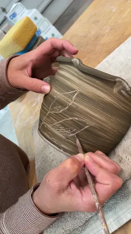 Sienna carving stoneware planters I threw, that were brushed with a clay slip, dug in our backyard.