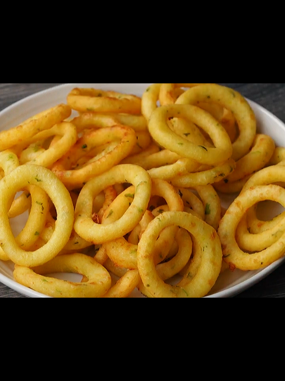 potato garlic ring chips/quick snacks/crispy potato rings Step By Step Process: 2 Boiled Potatoes  Mashed Well 1 Tbsp Butter  2-3 Garlic Clove  Saute For 30 Sec. ½ Tspn Salt  3 Tbsp Flour  Cook For 30 Sec.  1/3 Cup Water Cook Until Separate from the Pan  Boiled Mashed Potatoes Mix Well Cool Down For 5 Min. 1 Tbsp Coriander Leaves  ¼ Cup Corn Flour  Mix Well Take Some Dough  Roll Cut In Round Shape  Cut In Middle with Small Cutter Fry In Medium Heated Oil  Fry Until Golden & Crispy . . . #foryoupage #fyp #trending #potatorings #viral #EasyRecipe #tiktokfood @CRAVE CLIPS 