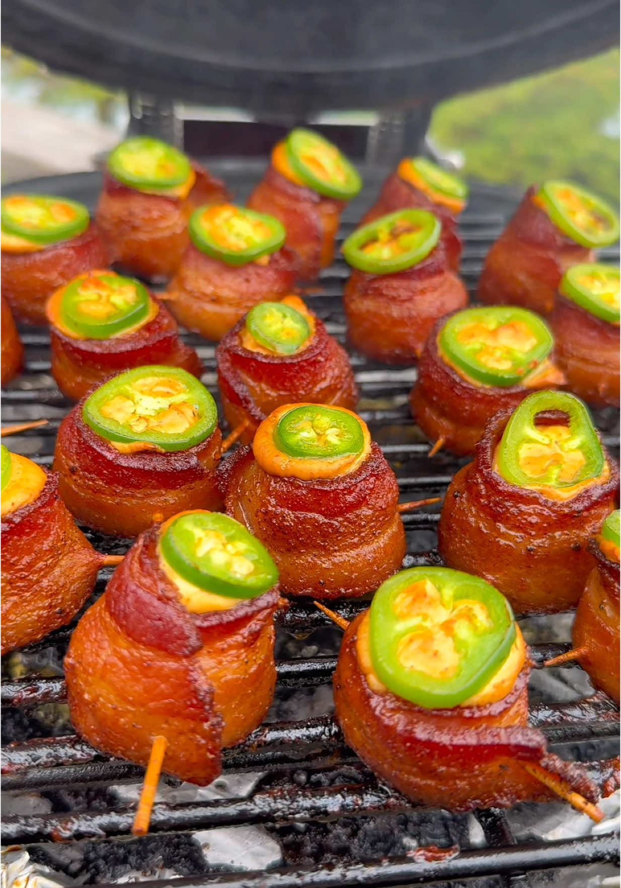 🔥 Smoked Jalapeño Pig Shots with Hot Honey🥓🌶🍯🔥 Ingredients (Makes ~24): * 12 slices thick-cut bacon, halved * 4–5 smoked sausages or links, cut into ½” rounds * 1 block (8 oz) cream cheese * 2 tbsp BBQ rub * 1–2 fresh jalapeños, thinly sliced * Hot honey, for drizzling * Toothpicks Steps: 1️⃣. Smoke the Cream Cheese - Score and season cream cheese with BBQ rub. Smoke at 225°F for 30 min, or until softened and starting to split. 2️⃣. Assemble Pig Shots - Wrap half-slice of bacon around each sausage round and secure with a toothpick to form a shot glass shape. Repeat to make ~24 shots. 3️⃣. Smoke the Pig Shots - Place on your Kamado at 325°F for ~1 hour, or until the bacon is crispy. 4️⃣. Fill & Finish - Add smoked cream cheese to a sauce bottle or piping bag. Fill each shot, top with a jalapeño slice, and drizzle with hot honey. 5️⃣. Final Cook - Cook another 10–15 min to set the filling and lightly roast the jalapeños. ⸻ Smoky, creamy, spicy, sweet. These go fast—make a double batch. 🔥🌶 #PigShots #SmokenVine #KamadoJoe #BBQSnacks #hothoneyheat #hothoney #bbq #bbqappetizer #appitizer #bitesize #delicious #yum #EasyRecipe #smoked #creamcheese #baconwrapped #bacon #bbqlovers #bbqfood #gameday #gamedayfood #sogood #teamred #getinmybelly #Recipe #crispybacon #honey #jalapeño #jalapenopoppers #pigshot #sausage #costal #california #mendocino #food #foodporn #Foodie #foodtiktok  @Kamado Joe @Jealous Devil @blazingstarbbq @blazingstarshop @Philly Cream Cheese @Aidells Sausage @AMF @FOOD 🍟 @Food Network @foodandwine @Foodies @Foodporn @Foodie @Mike’s Hot Honey @HemplerFoods @Benchmade Knife Co., Inc. @Benchmadeknifecompany @Benchmade Knife Co., Inc. 