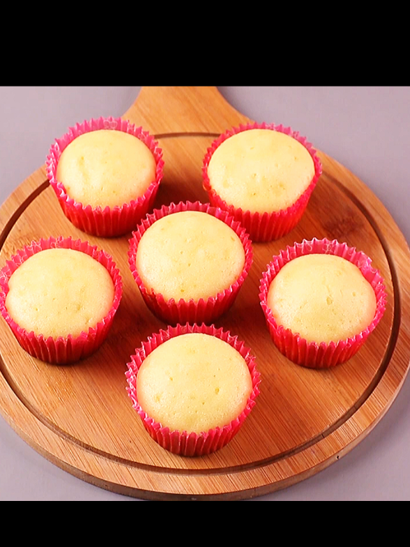 Vanilla cupcakes/sponge and fluffy pancakes without oven  INGREDIENTS & PROCESS: 1 EGG ½ CUP POWDER SUGAR (MIX GRADUALLY) ¼ CUP OIL ½ TSPN VANILLA ESSESCE 1 CUP FLOUR 1 TSPN BAKING POWDER ½ CUP MILK BRUSH OIL IN A CUP CAKE MOULD PLACE PAPER IN MOULD FILL THE MOULD ½ WITH THE BATTER PLACE A PAN  PLACE A WIRE STAND PRE-HEAT 5-7 MIN. PLACE THE MOULD COOK IN LOW MEDIUM HEAT FOR 15-18 MIN. FOR OVEN: BAKE IT IN 180 PRE-HEAT OVEN FOR 15 MIN. CAKE IS READY, COOL DOWN . . . #foryoupage #fyp #trending #vanillacupcakes #easybaking #viral #tiktokfood@CRAVE CLIPS 
