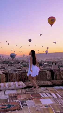 Rooftop shot at sunrise with a view of hot air balloons… #cappadocia #flyingdress #cappadociaphotographer #cappadociaphotodream #bucketlist #goturkey #visitturkey #kapadokya 