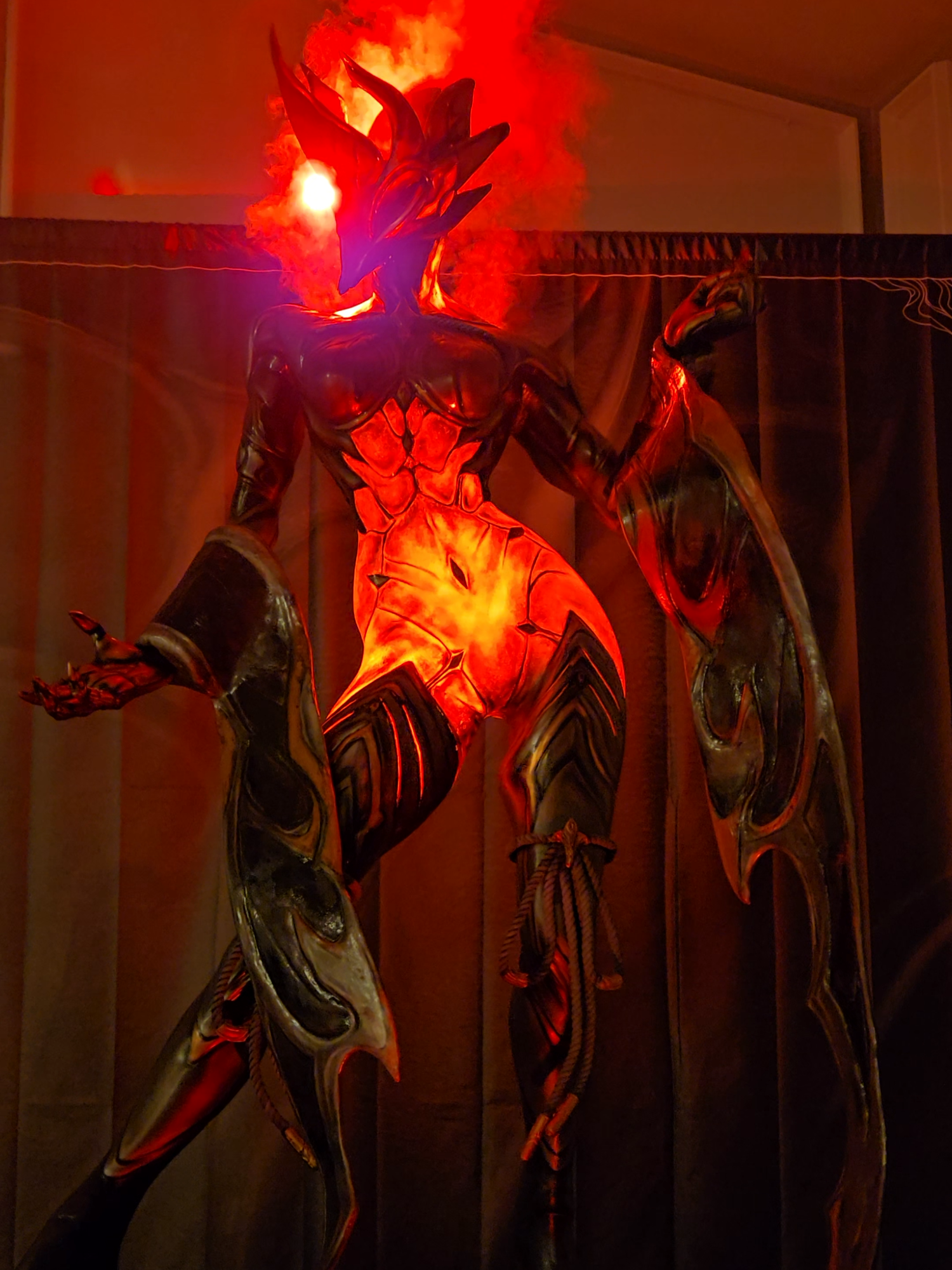 Ember Heirloom is ready for her in-person debut at #TennoCon 2025!  This shifting statue of cinders will be standing sentinel over the registration area in the Doubletree Hotel, greeting visitors as they pick up their badges this year. #warframe #warframecommunity #ps4 #ps5 #iOS #xbox #pcgaming #pc #nintendo #fyp #foryoupage #TennoCon2025