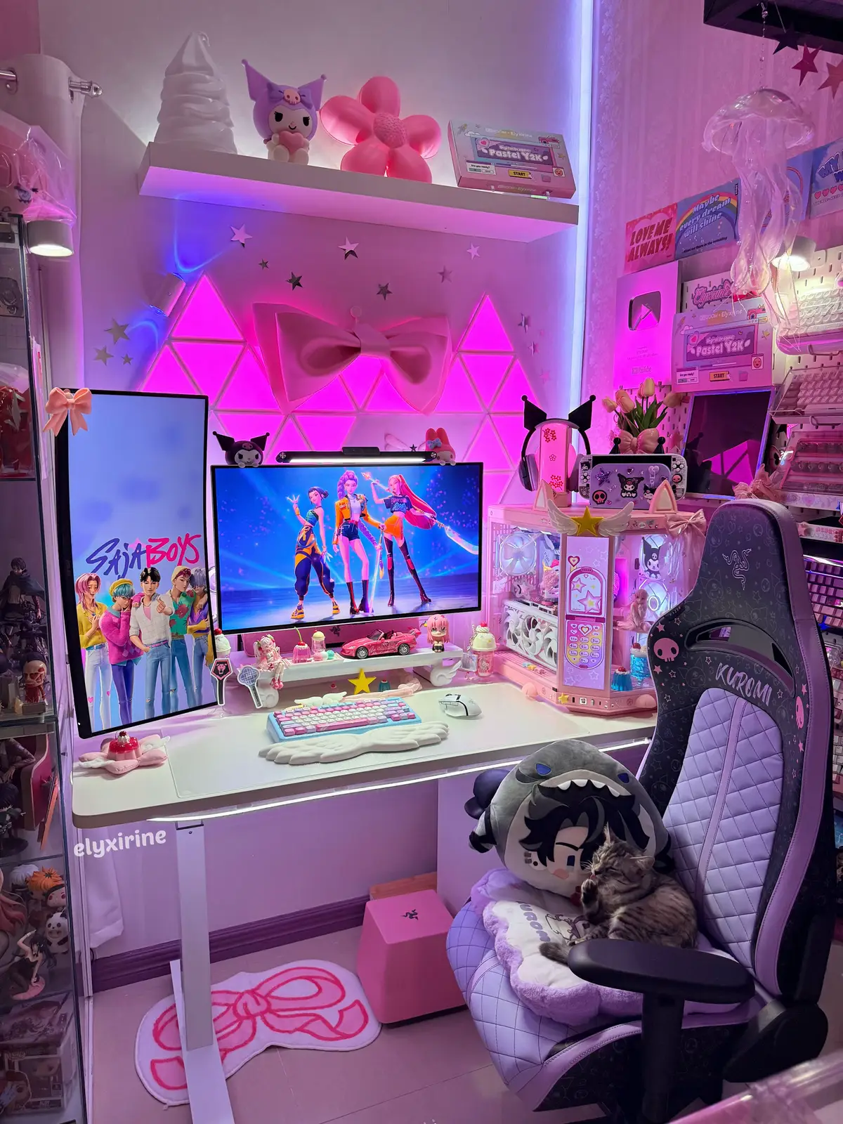 my PC setup is basically just a heater for my cat, Mallows 😹🐾 enjoy the weekend gamerz and furparents!  setup details and cødes: ▫️Gaming chair: Razer Enki X Kuromi *gfted @razer ▫️PC case: HYTE Y70 touch infinite *gfted @hytebrand  ▫️Keyboard: KiiBOOM Phantom 81 Lite with Digital Dreams: Pastel Y2K keycap set by KiiBOOM x Elyxirine *gfted @kiiboom.official (dscount c0de: ELYXIRINE)  ▫️Mouse: Basilisk V3 pro *gfted @razer  ▫️Headset: Razer Kraken BT Kuromi *gfted @razer + Crystal stand *gfted @yowu.chan #kpopdemonhunters #hytey70touchinfinite #huntrix #sajaboys #rujinu #jinumi #pcsetup #battlestation #GamingSetup #desksetup #setupinspiration