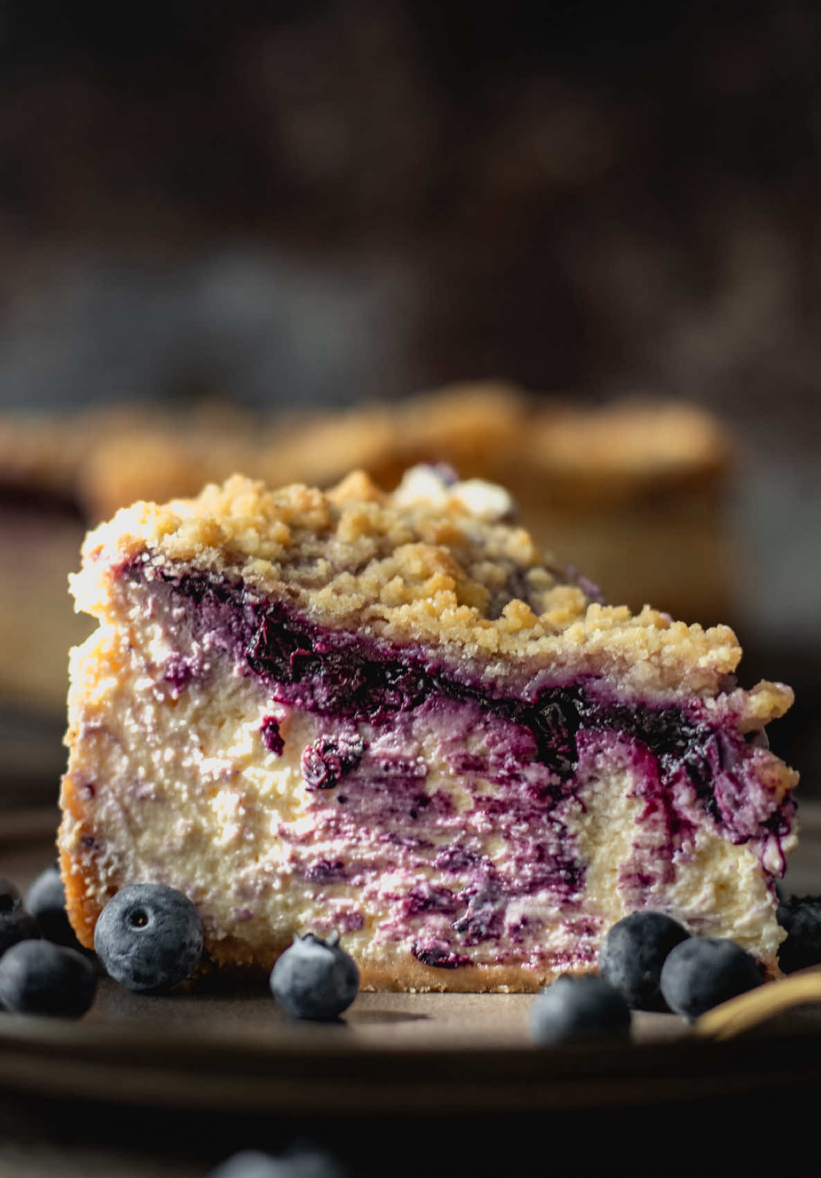Blueberry Streusel Cheesecake Ingredients: Crust: • 2 cups (200 g) graham cracker crumbs (or any other biscuits) • 6 tbsp (85 g) unsalted butter, melted Filling: • 24 oz (675 g) cream cheese, softened • 3/4 cup (150 g) granulated sugar • 3 large eggs • 1 cup (240 g) sour cream Blueberry Layer (Cooked): • 1 1/2 cups (200 g) frozen blueberries • 2 tbsp (25 g) granulated sugar • 1 tbsp (15 ml) lemon juice Streusel Topping: • 1/2 cup (60 g) all-purpose flour • 1/3 cup (65 g) granulated sugar • 1/4 cup (57 g) unsalted butter, cold Instructions: 	1.	Preheat the oven to 325°F (160°C). Line the bottom and sides of a 9-inch (23 cm) springform pan with parchment paper. 	2.	In a small saucepan, combine the blueberries, sugar, and lemon juice. Cook over medium heat for 5–7 minutes, until the berries burst and the mixture thickens slightly. Set aside to cool. 	3.	In a bowl, mix the graham cracker crumbs and melted butter. Press the mixture firmly into the bottom of the prepared pan. 	4.	Bake the crust for 8–10 minutes. Let it cool while you prepare the filling. 	5.	In a large bowl, beat the cream cheese and sugar until smooth. 	6.	Add the eggs one at a time, mixing on low speed just until incorporated. 	7.	Add the sour cream and mix until the filling is smooth and well combined. 	8.	In a small bowl, combine the flour and sugar for the streusel topping. 	9.	Grate in the cold butter and rub it in with your fingers until the mixture resembles coarse crumbs. 	10.	Pour the cheesecake filling over the cooled crust. 	11.	Spoon the cooked blueberry mixture in small dollops over the top and lightly swirl or spread. 	12.	Sprinkle the streusel topping evenly over the surface. 	13.	Bake the cheesecake at 325°F (160°C) for 60–70 minutes, or until the edges are set and the center is just slightly jiggly. 	14.	Let the cheesecake cool completely in the pan. Then refrigerate for at least 4 hours or overnight before serving. Enjoy! #blueberrycheesecake #baking #blueberries #cheesecake #creatorsearchinsights 