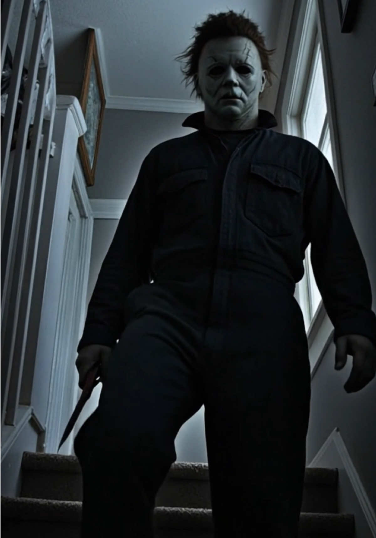 You hear your stairs creak... But no one's supposed to be home.  Then he appears. Silent. Unstoppable.🩸🔪 Would you run or freeze? 🏃⛄ Want any kind of Custom Ai Horror Video made? Dm Us! 💌 #michaelmyers #halloween #halloweenhorror #aihorror #ai #slasher #fyp #horrorfan #horroraesthetic 