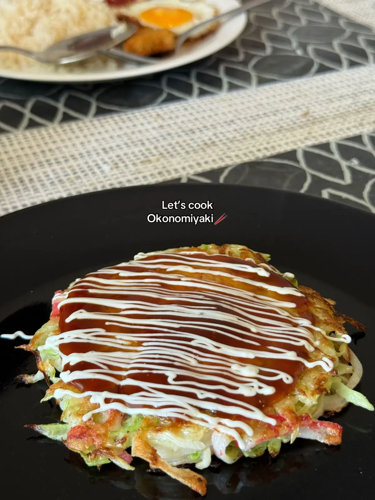 A savory Japanese pancake made with a batter and shredded cabbage, often referred to as 
