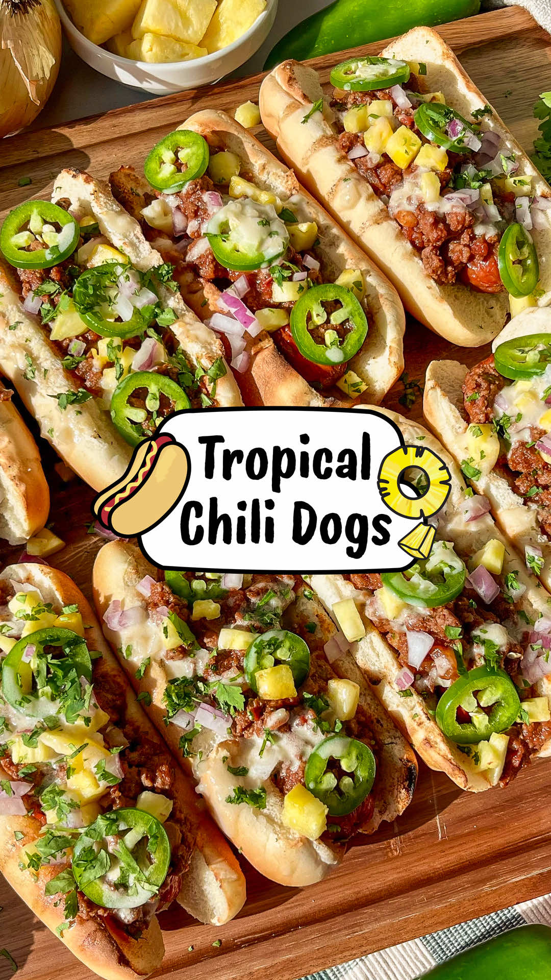 The chili dog is already about adding more to what’s already great, so we took it a step further with our tropical chili dog recipe. Pay homage to a classic while giving your taste buds an experience they’ll never forget! 🌭🍍💛 Ingredients: • 8 hot dog buns • 8 large beef dogs, grilled • Chili (see below) For the toppings:  • Fresh pineapple, diced • Sliced jalapeño • Red onion, diced • Cilantro, chopped • Homemade creamy pineapple coconut sauce (see below) For the chili:  • 1 tbsp neutral cooking oil • 1 cup sweet onion • 1 tbsp garlic, minced • 1 lb ground beef • 1 cup crushed tomatoes • 1 tbsp tomato paste • ½ cup Harmless Harvest Organic Sparkling Coconut Water • 1 tbsp honey • 1 tbsp chili powder • ½ tsp cumin • ½ tsp paprika • 1 tsp salt For the homemade creamy pineapple sauce: • 1 tbsp unrefined coconut oil • 2 tbsp shallot, finely minced • ¾ cup coconut cream • ⅔ cup pineapple juice • ⅓ cup Harmless Harvest Organic Sparkling Coconut Water • 1 tbsp lime juice, freshly squeezed • ¼ tsp salt Chili Instructions: 1. To prepare chili, heat oil in a skillet over medium-high heat 2. Add onions and sauté until lightly browned 3. Add garlic and continue to sauté another 1-2 minutes 4. Add ground beef and sauté until beef is fully cooked and browned  5. Reduce heat to low-medium 6. Add crushed tomatoes, tomato paste, Harmless Harvest Organic Sparkling Coconut Water, honey, chili powder, cumin, paprika, and salt 7. Mix well and simmer about 20 minutes until thick 8. Serve over hot dogs Creamy Coconut Pineapple Sauce Instructions: 1. To prepare sauce, heat coconut oil in skillet over medium heat 2. Add shallots and sauté until soft (about 5 minutes)  3. Add coconut cream, pineapple juice and Harmless Harvest Organic Sparkling Coconut Water 4. Mix until all ingredients are combined and simmer uncovered until thickened while periodically stirring to prevent burning (about 10 minutes) 5. Remove from heat and stir in fresh lime juice and salt 6. Allow time for sauce to cool (sauce will continue to thicken!) Tropical Chili Dog Instructions: 1. Prepare hot dogs and buns of choice 2. Top with chili and homemade creamy pineapple coconut sauce #chili #hotdog #recipeshare 