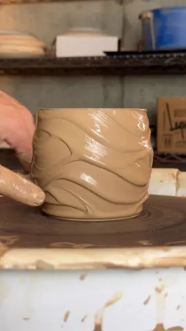 Want an eye-catching surface design without spending hours nitpicking? Try this: I start with about 0.75lb of clay and throw a 3.5” x 3.5” cylinder with a slight barrel shape. While it’s still on the wheel, I pre-trim a shallow foot, so I don’t have to mess with the texture later. Then comes the magic. Slip applied in an upward and downward spiral motion while the wheel spins. It creates this unpredictable, organic pattern that’s completely unique to each throw. Pro tip: run your slip through a sieve a few times for a buttery smooth consistency. No chunks, no drag, just clean movement. Give it a shot and let me know how it works for you. Hope this adds something new to your pottery tool-belt!  #pottersoftiktok #ceramicarts #potteryprocess #slipdecoration #wheelthrowing #ceramictexture #claycommunity #potteryhack #handmadeceramics #throwingtips #functionalceramics #ceramictechniques #mudmagic #claytips #natewinterstudios #barrelform #makersmovement #organicpattern #potterywisdom #studiosecrets #surfaceexploration #ceramiclove #potterylife #mudandfire #creativeprocess