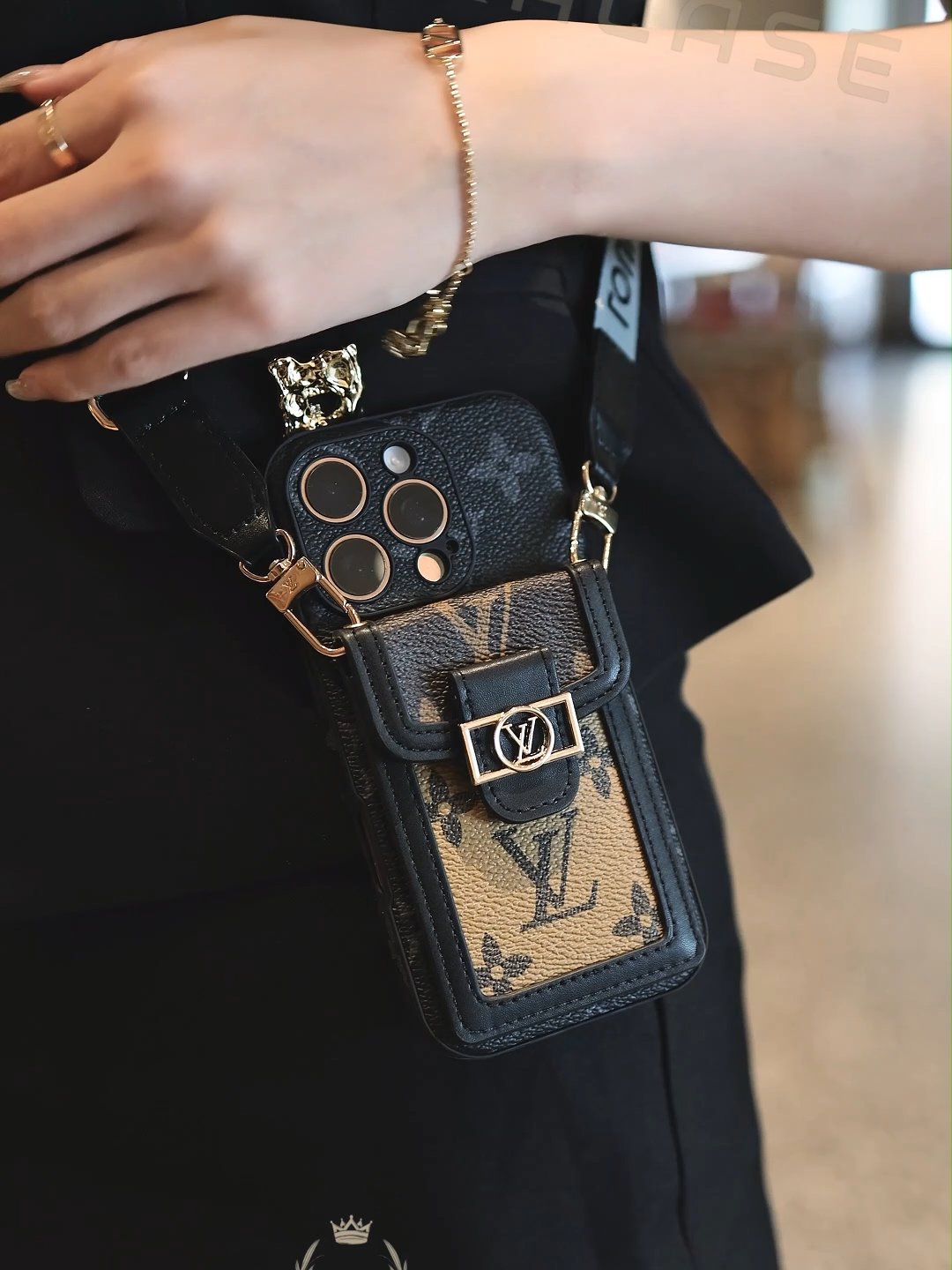 Elevate your phone with luxury & practicality. This case blends leather, black - gold patterns, a handy strap, and a front pocket. Ideal for trendsetters wanting style + function.