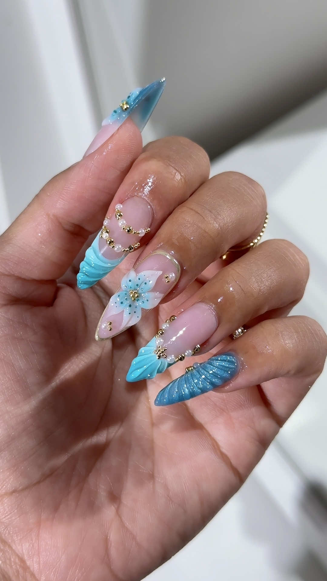 tropical turquoise nails 🩵✨🐠⚜️ did some island glam with 3d swirls, 3d flower and gold bead details. would you wear these on your next vacay? #tropicalnails #3dnailart #luxurynails #summernailinspo #turquoisenails   