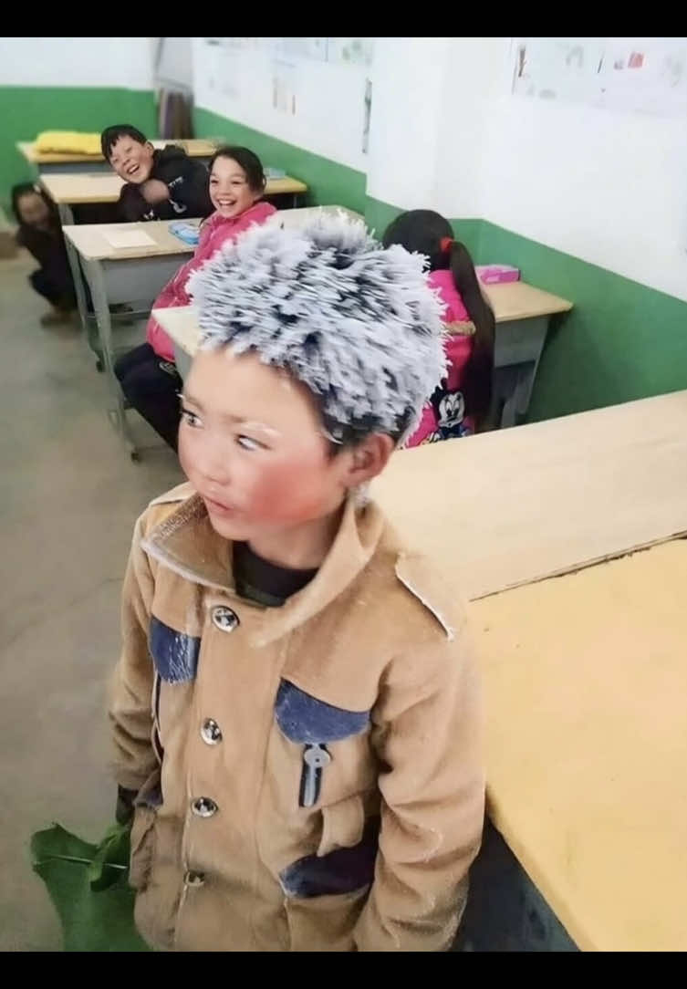 In 2018, eight year old Wang Fuman from rural Yunnan, China, touched hearts across the country when a photo of him went viral showing him arriving at school with his hair and eyebrows covered in frost after walking 3 miles in freezing temperatures. Despite the harsh conditions, Wang made the long journey every day, determined to get an education. The image sparked nationwide sympathy and led to donations that helped improve his school and living conditions. Wang's story became a symbol of resilience and the challenges faced by students in remote areas.