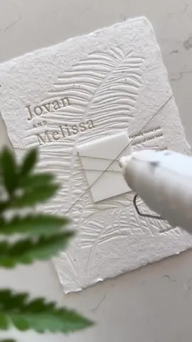 Textured wedding invitations for the perfect beach wedding 🌴 Letterpress printed on plantable seeded handmade paper, featuring a blind embossed palm tree, and wrapped with a wax seal belly band using real pressed flowers. I truly love creating sustainable wedding invitations like these—designed to wow your guests and grow something beautiful long after the day is over. #modernwedding #destinationwedding #beachwedding #mexicowedding #weddinginspiration #modernweddinginvitations