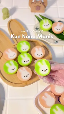 Miffy Nona Manis ✨ bikin jajan pasar lagi karena banyak yg request😆 sukaaa bgt ama kue ini, tekstur kenyal, empuk, manis, makan 1 aja ga cukup🥲 coba2 dibikin kiyowo ala aku & voilaaa ✨ cocoknya dijual harga berapa ya?🫣 buat bikin dessert / cake, gula pasir itu penting bgt jadi jgn ngasal pilih~ disini aku pake Gula Premium @gula.psm , warnanya putih bersih cocok buat baking & masak sehari-hari👩‍🍳 👩‍🍳Nona Manis (20pcs) source: Chalista Kitchen with modified 📝Bahan A: 1 butir telur 100gr gula pasir PSM  110gr tepung terigu serbaguna 200ml santan cair 📝Bahan B: 2sdm tepung maizena 200ml santan cair 1sdt pasta pandan / pewarna pink 📝Vla: 400ml santan cair 20g maizena 10g terigu 15gr gula pasir sejumput garam steps: 1. campur semua bahan A sampai tercampur rata & tidak ada gumpalan. sisihkan 2. dalam pan anti lengket, masak bahan B di api kecil sambil terus diaduk hingga mengental. kemudian langsung tuang bahan A & aduk hingga tercampur rata (supaya tdk ada gumpalan bisa disaring). 3. jika mau bikin 2 warna, bagi adonan sama rata & beri pasta / pewarna secukupnya 4. vla santan: campur semua bahan ke dalam panci (kompor mati). aduk dengan whisk sampai menyatu. nyalakan api kecil & masak hingga mengental tapi masih agak encer 5. olesi cetakan uk 3.5cm dengan minyak. tuang adonan kue 3/4 (jangan sampe penuh). lanjut tuang vla santan perlahan seperti di video 6. kukus di api kecil selama 20 menit. setelah matang biarkan hangat / dingin & keluarkan kue dari cetakan — @i._.cha  ❕please do not repost my videos without permission.  #gulakristalpremiumpsm #homecafe #homecafé #homecooking #homebaking #homebaker #coquette   