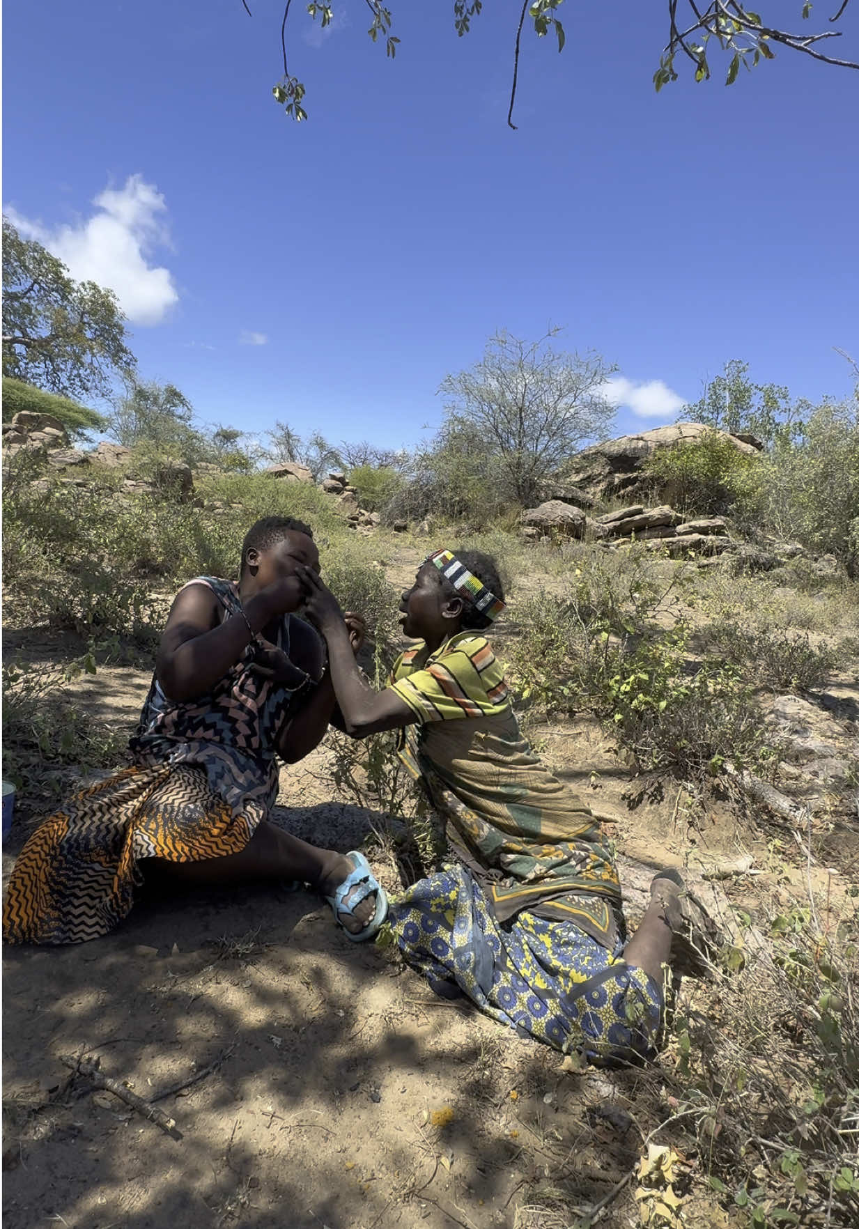 “Sweet Treats with Sweet Souls 🍬💃” Two Hadzabe women trying an Indian sweet for the first time — and judging by their smiles, they totally loved it! 😆 Such pure joy and curiosity in every bite. Moments like these melt hearts across cultures 💛 #fyp #viral #triballife #explorepage #sweetmoments #globalculture #culturalexchange
