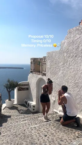Our dream Santorini proposal accidentally turned into a Snickers ad 🍫💍 @snickers #snickers call us  You couldn’t script something this unexpectedly hilarious.  Let us know what you think in the comments 🤣 #snickersad #dreamproposal #santoriniproposal #santorini #coupleshumor #couples #fyp 