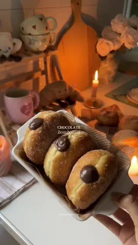 So fluffy & delicious!🤎 Recipe below👇🏼  🍩 Ingredients Dough: * 300g strong white bread flour * 30g caster sugar * 1/2 tsp salt * 7g fast-action yeast * 2 eggs * 75ml warm milk * 50g melted butter Chocolate Pastry Cream: * 540g whole milk * 2 tsp vanilla extract * 18g cocoa powder * 2 eggs * 2 egg yolks * 100g brown sugar * 25g cornstarch * ¼ tsp sea salt * 170g milk chocolate, chopped * 30g butter 🧾Instructions 1. Make the Dough Mix flour, sugar, salt, and yeast in a bowl. Add eggs, warm milk, and melted butter. Knead until elastic by hand or in mixer. Cover and let rise for 1 hour. 2. Shape & Proof Punch down the dough and divide into 65g portions. Roll each piece into a smooth ball and place onto individual squares of baking paper. Arrange on a tray, cover loosely, and let rise for another hour.  3. Make Chocolate Cream Heat milk and vanilla until steaming. In a bowl, whisk cocoa, eggs, yolks, sugar, cornstarch, and salt. Slowly add the hot milk while whisking constantly, then return to pan and cook until thick & bubbling. Off heat, stir in chocolate and butter. Chill with plastic wrap touching the surface. 4. Fry the Donuts Fry donuts in hot oil. Fry until golden. Drain and roll in sugar. 5. Fill Transfer the chilled chocolate pastry cream to a piping bag fitted with a round nozzle. Poke a small hole in the side of each donut and pipe in the filling generously.  Enjoy! 🤎 #baking #donuts #donutlover #chocolatedonut #explore #baketok #dessert #sweettreat #bomboloni #aesthetic #trending #viral #Recipe #bakingtherapy #asmr #lanadelrey #pinterest #girltherapy #imjustgirl 