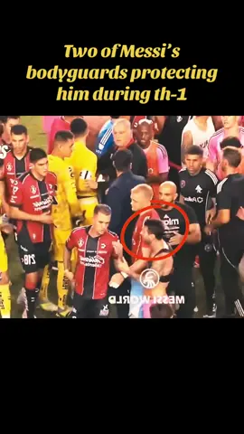 Two of Messi’s bodyguards protecting him during th-1